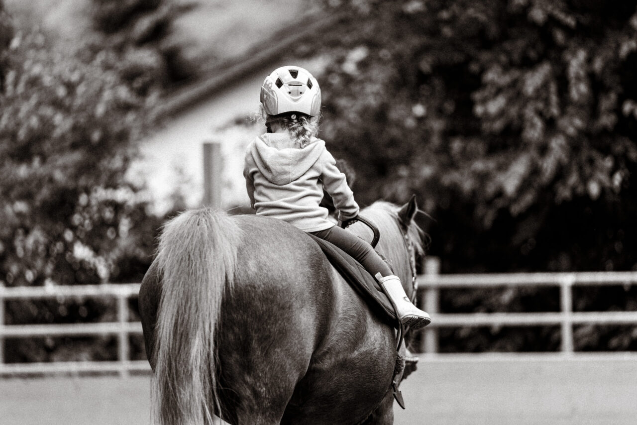A child riding a horse
