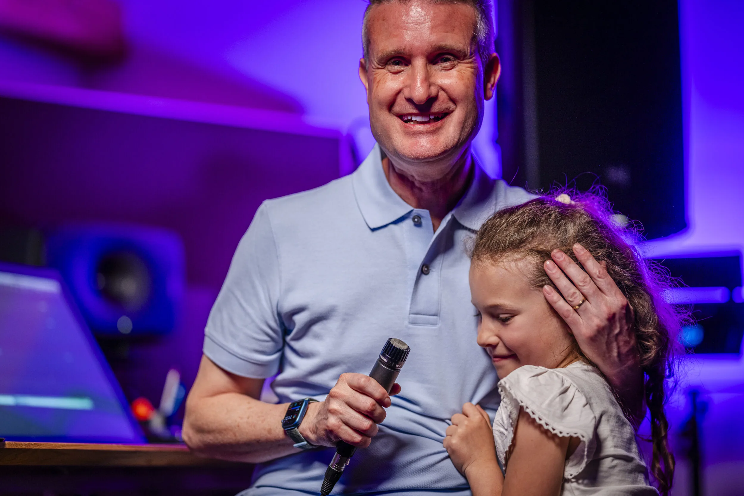 Stefan Ruf sharing a studio moment with a child