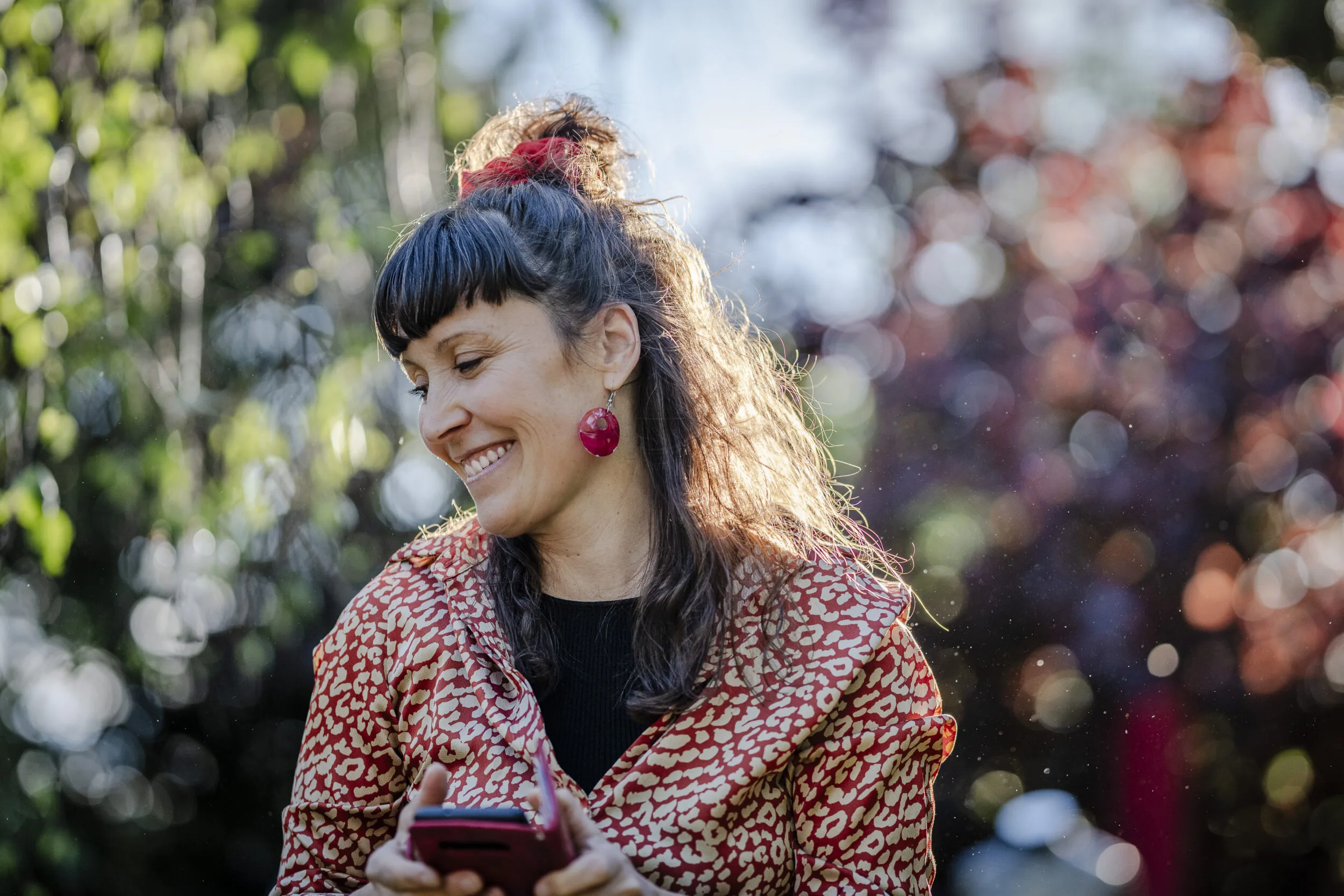 Portrait of a smiling woman in a garden