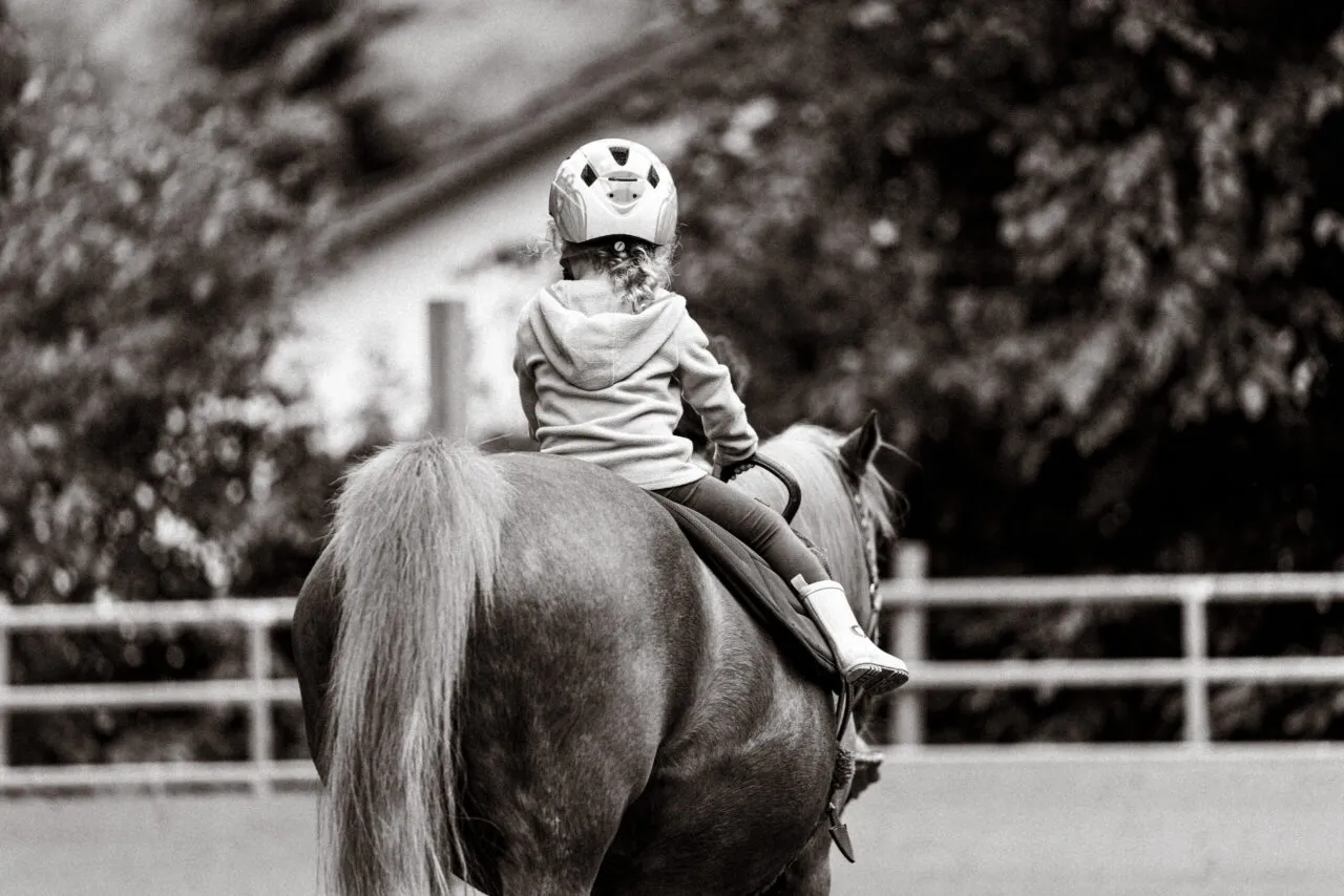 A child riding a horse