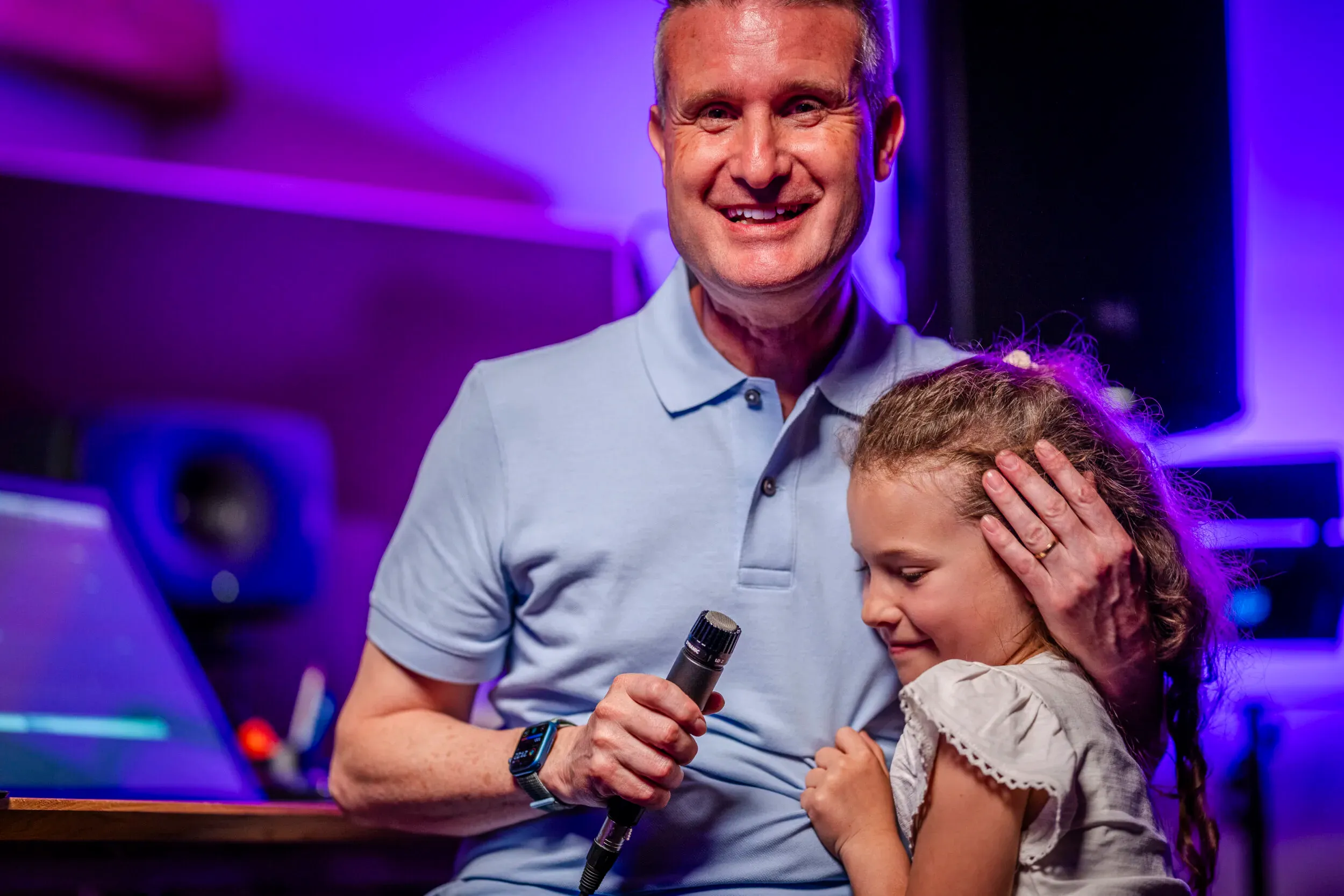 Stefan Ruf sharing a studio moment with a child